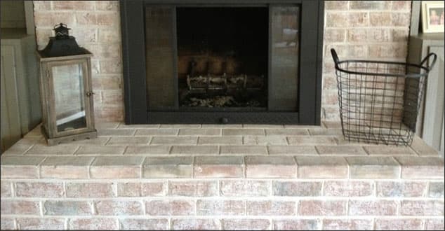 Whitewash brick fireplace. 